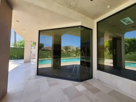 Corner glass tinted by the pool