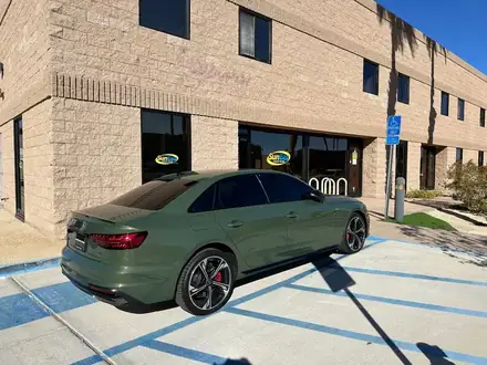 Green Audi with window tint