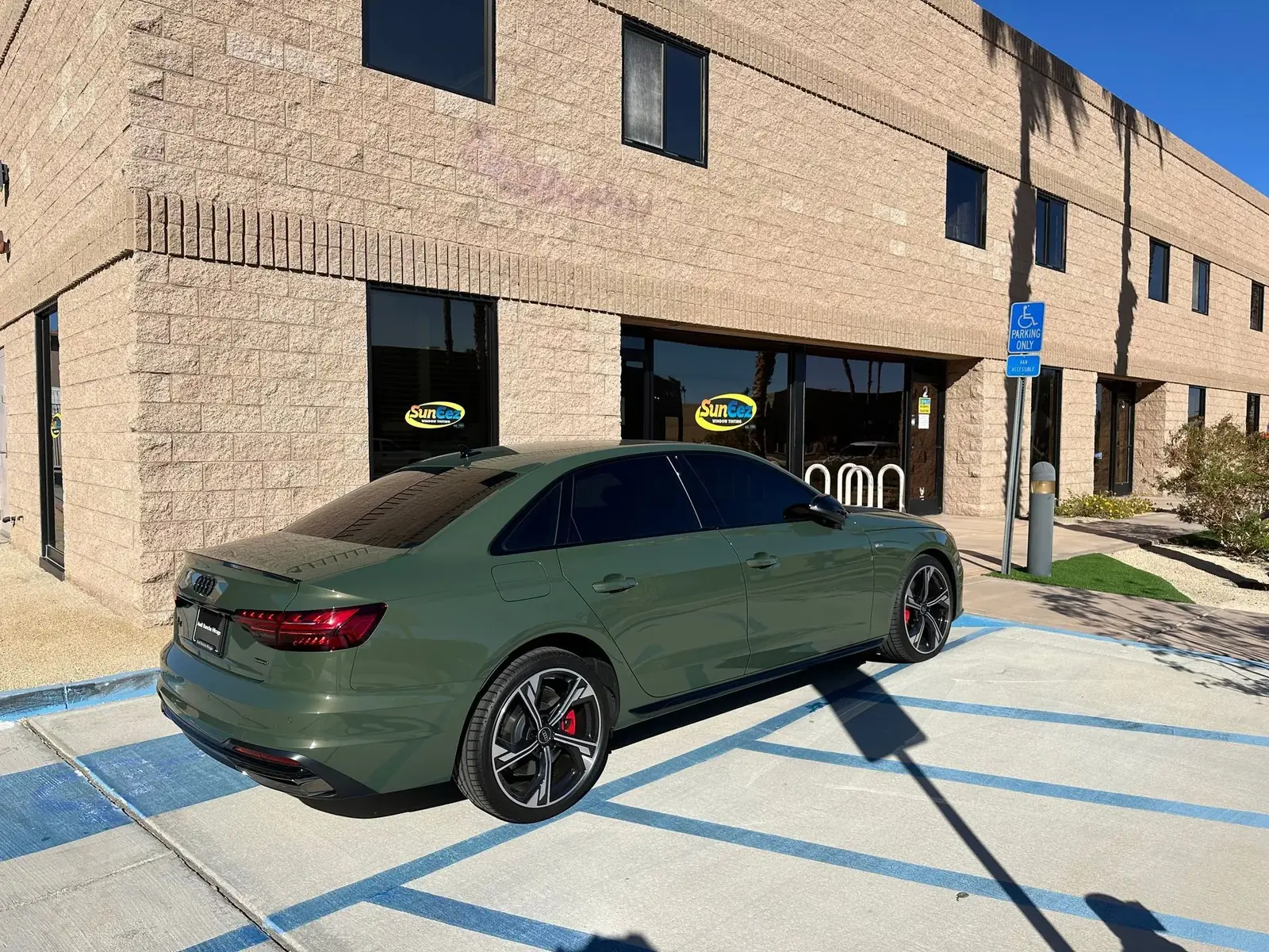 Green Audi with new window tint