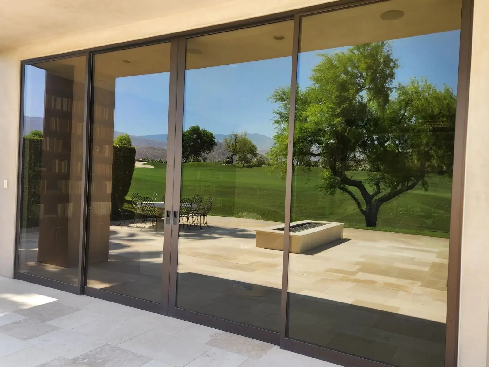 Tinted sliding doors facing a golf course
